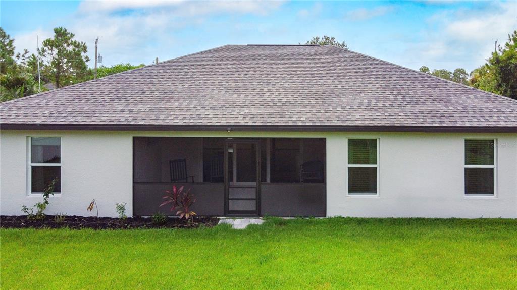 2713 Embassy Road North Port, FL 34291 - Photo 27 of 30 a view of a house with a yard