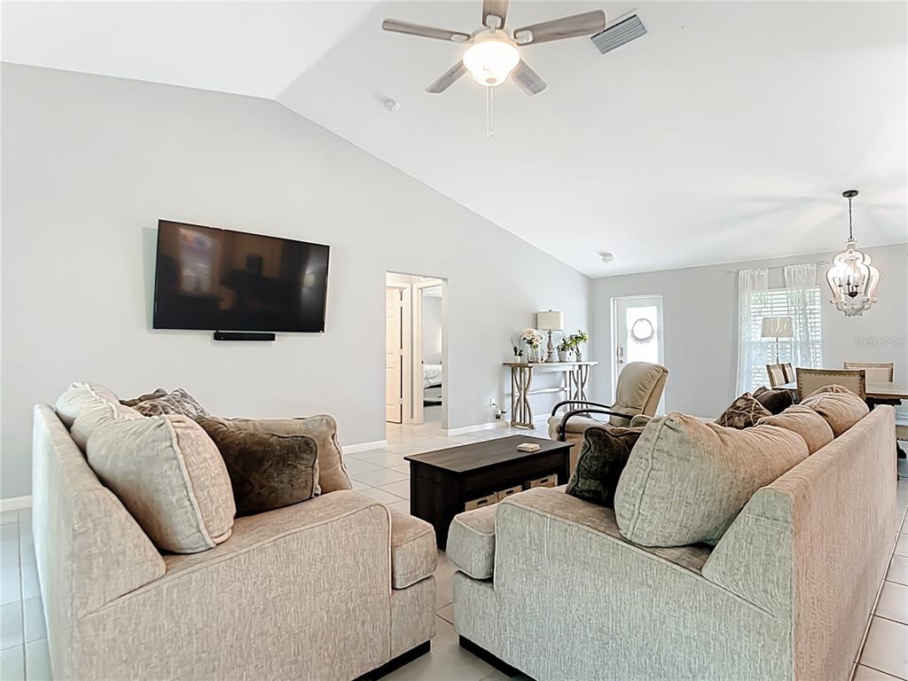2713 Embassy Road North Port, FL 34291 - Photo 8 of 30 a living room with furniture and a flat screen tv