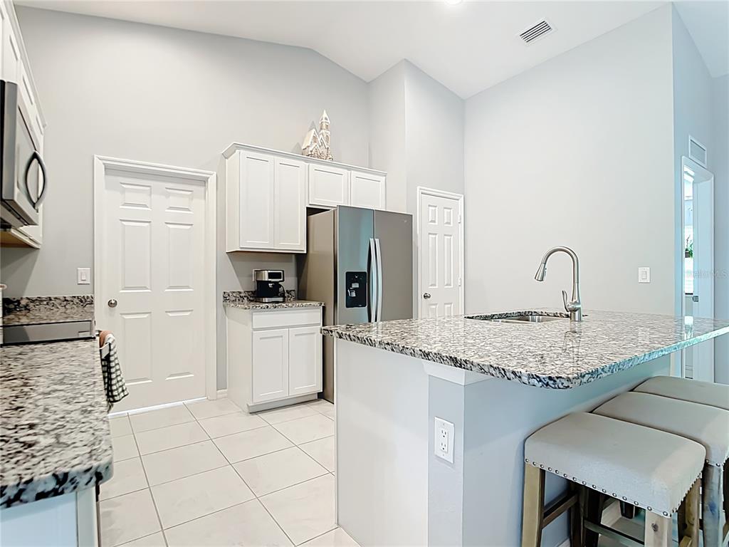 2713 Embassy Road North Port, FL 34291 - Photo 9 of 30 a kitchen with a sink cabinets and window