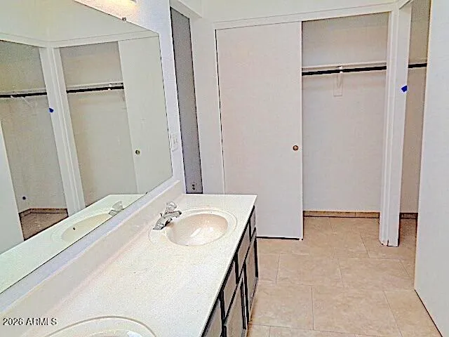 a bathroom with a sink and mirror