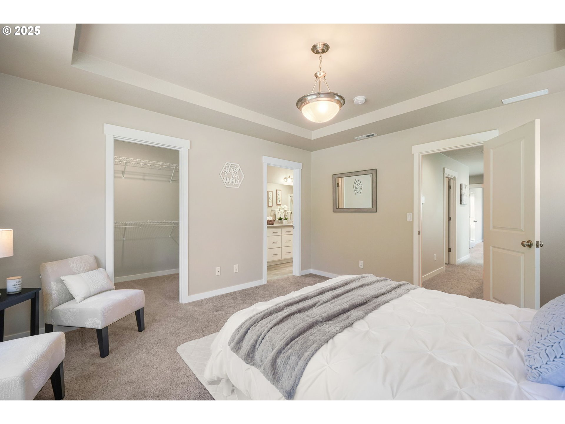 5139 Northwest Torchcrest Place Corvallis, OR 97330 - Photo 39 of 48 a bedroom with a bed and a chandelier