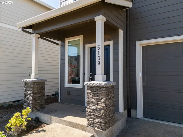 a front view of a house with outdoor seating