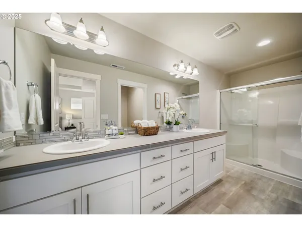 a bathroom with a sink vanity and a mirror