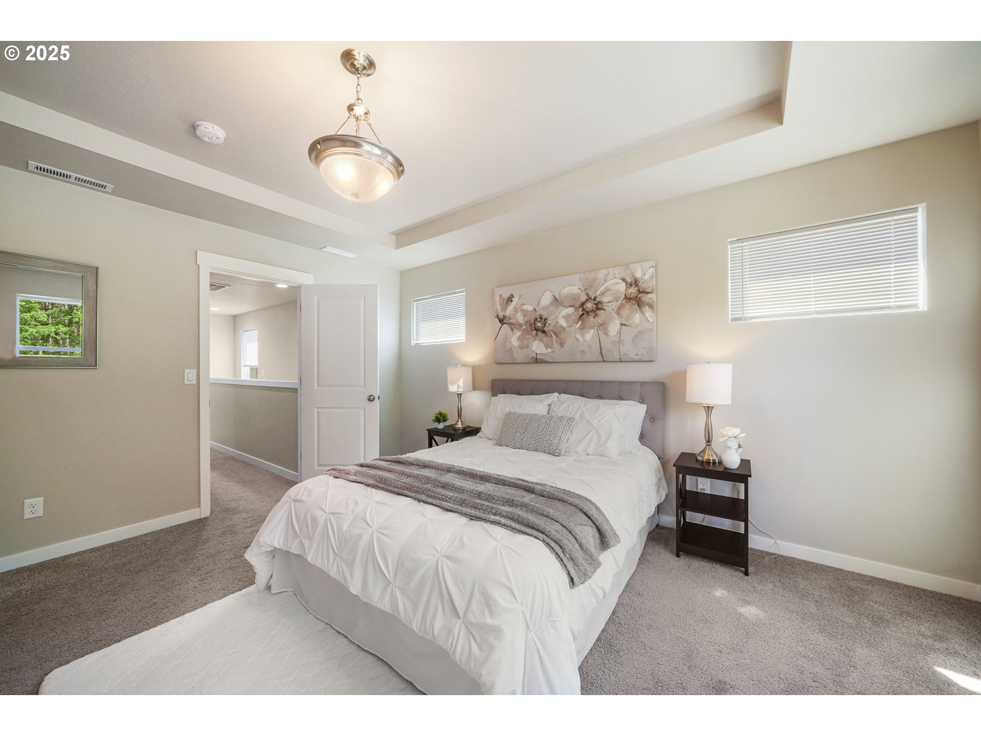 5139 Northwest Torchcrest Place Corvallis, OR 97330 - Photo 43 of 48 a bedroom with a bed and a chandelier