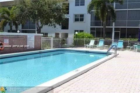 a view of a house with a swimming pool