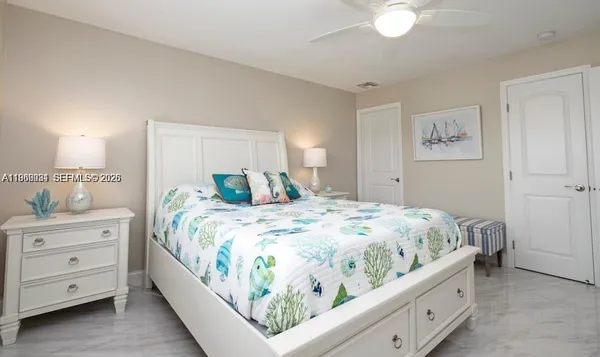 a bedroom with a bed and a dresser