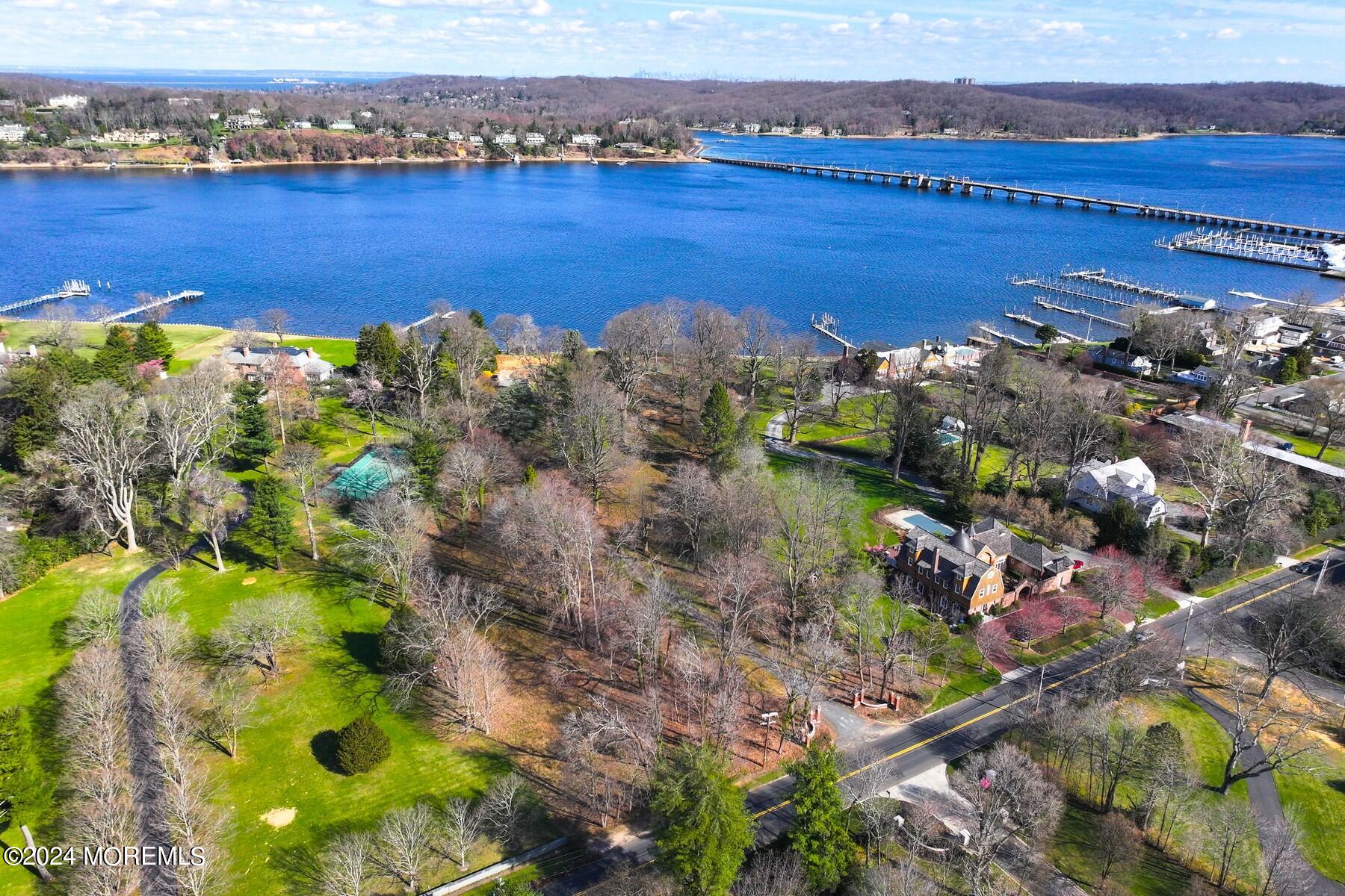 70 River Road Rumson, NJ 07760 - Photo 17 of 30 a view of a lake with a building in the background