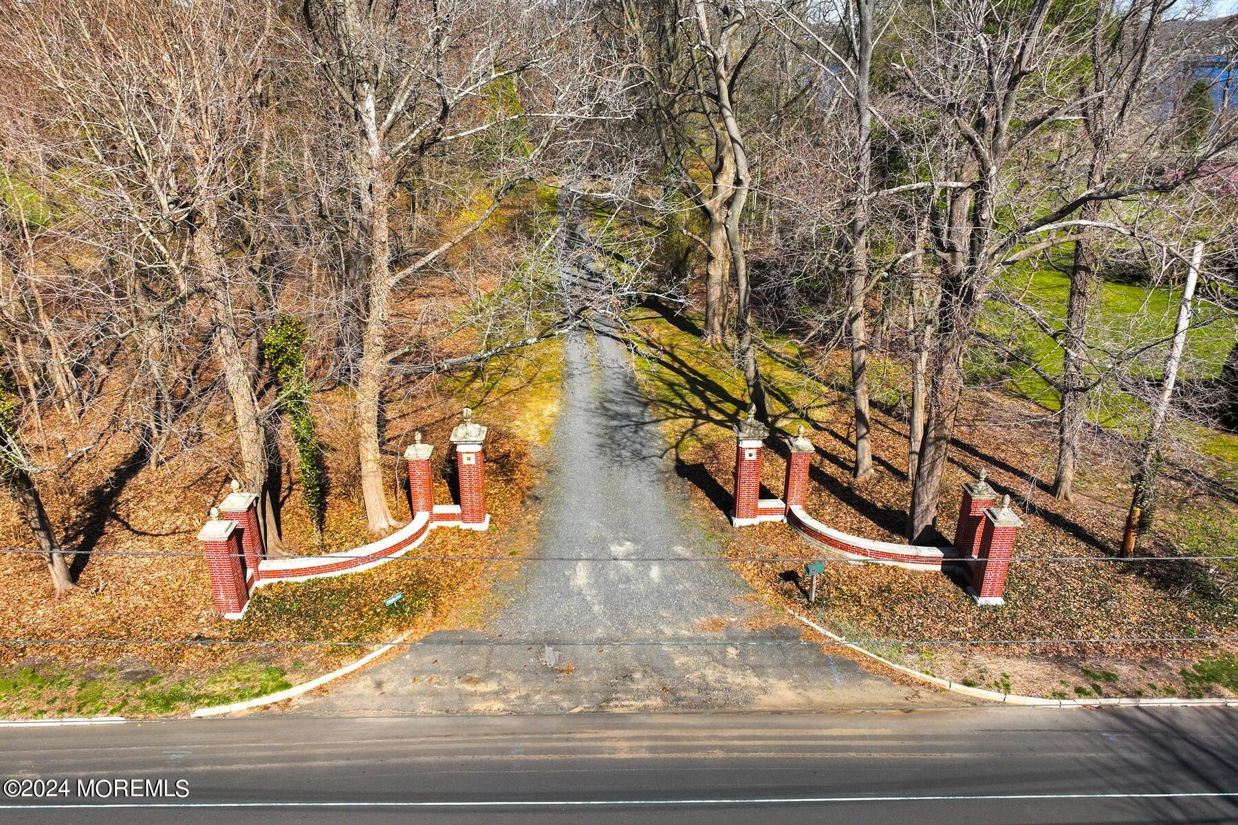 70 River Road Rumson, NJ 07760 - Photo 21 of 30 a view of a yard with large trees