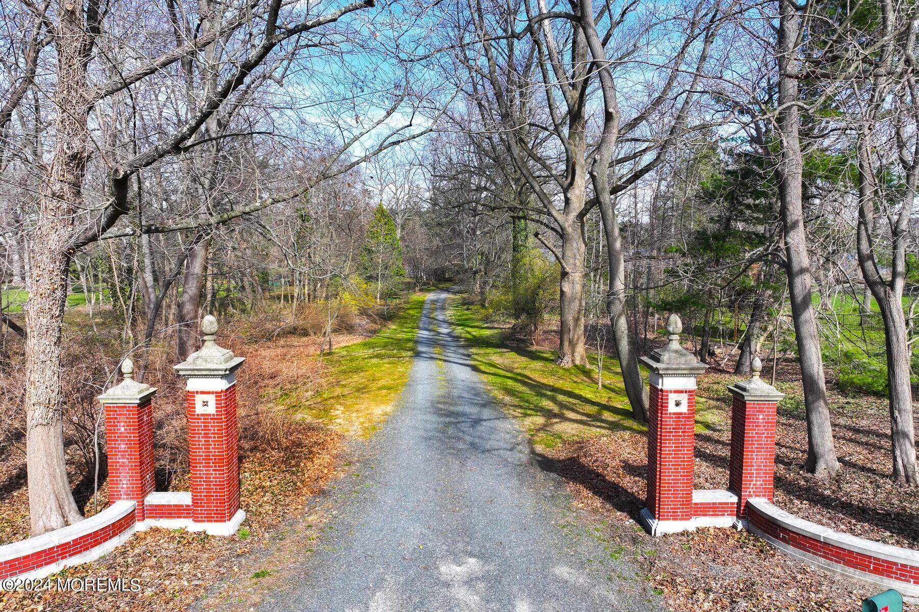 70 River Road Rumson, NJ 07760 - Photo 22 of 30 a view of a park with large trees