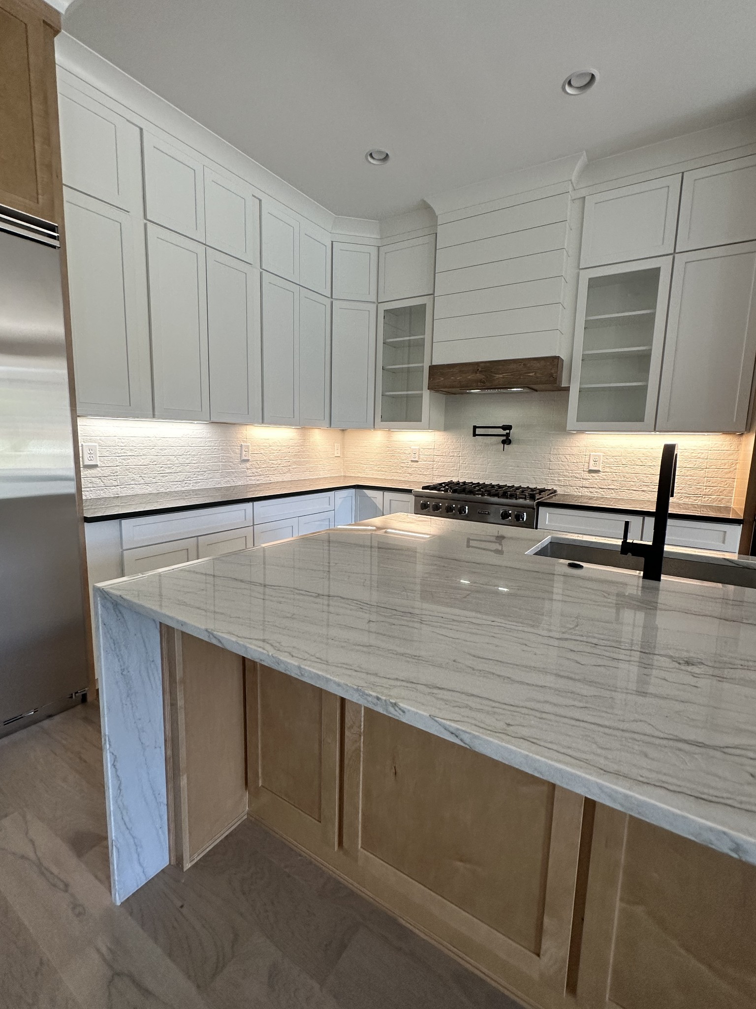 2150 B Philadelphia Lebanon, TN 37087 - Photo 12 of 46 a kitchen with kitchen island a sink a stove and cabinets