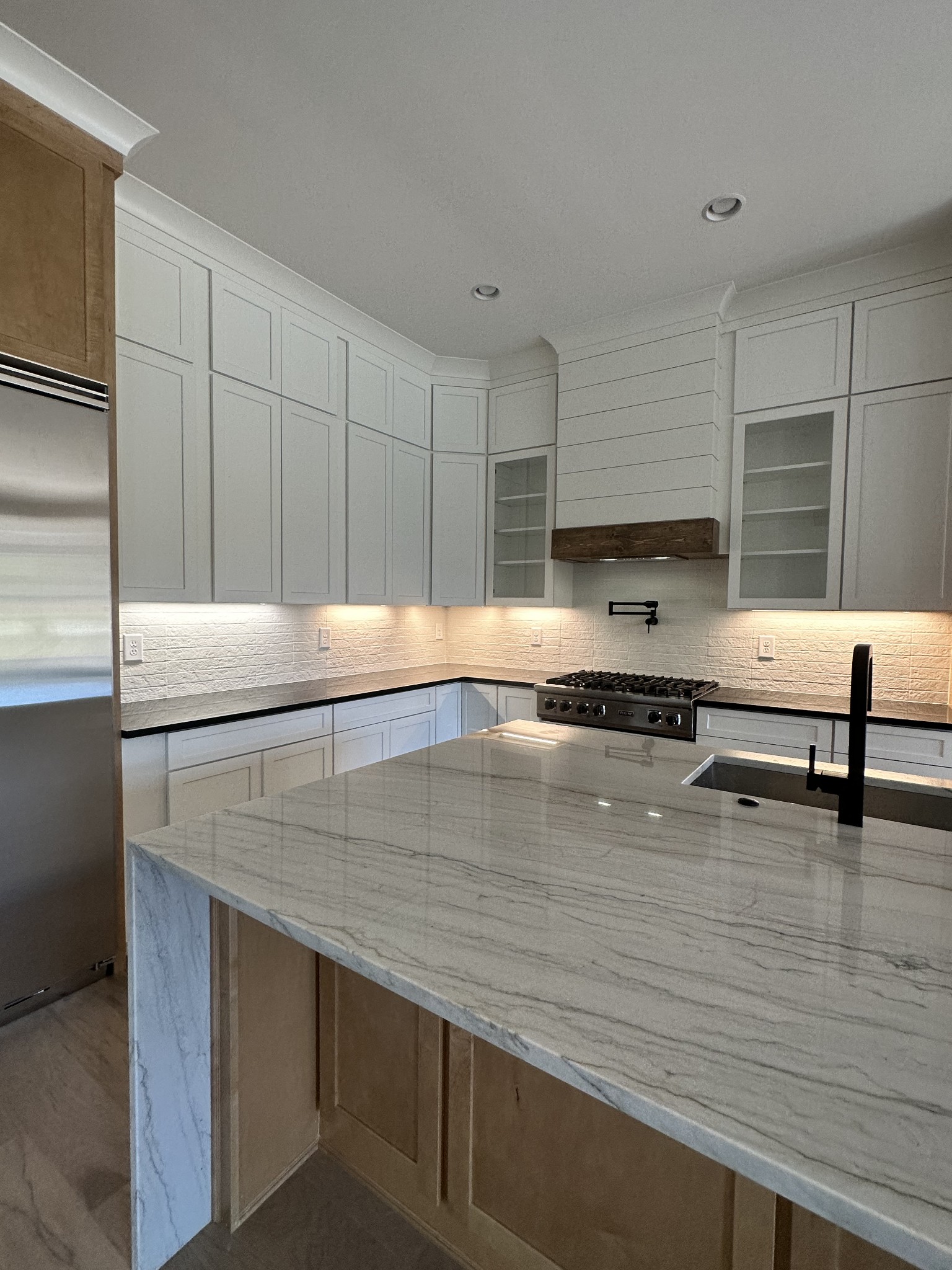 2150 B Philadelphia Lebanon, TN 37087 - Photo 10 of 46 a kitchen with kitchen island a sink white cabinets and stainless steel appliances