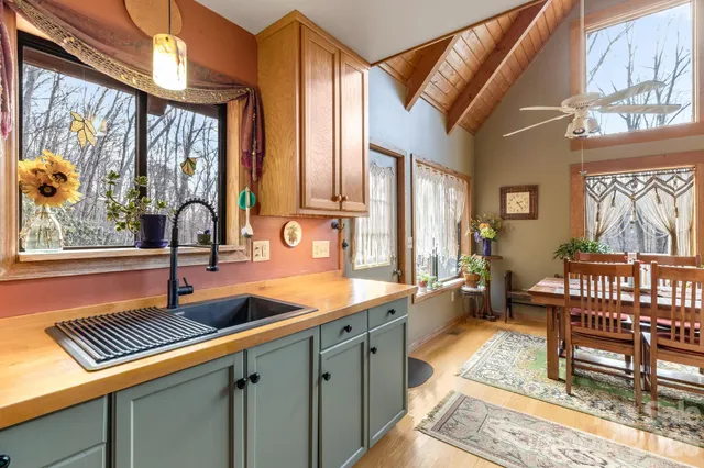 a kitchen with a sink and a stove top oven