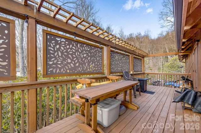 a balcony with furniture and wooden floor