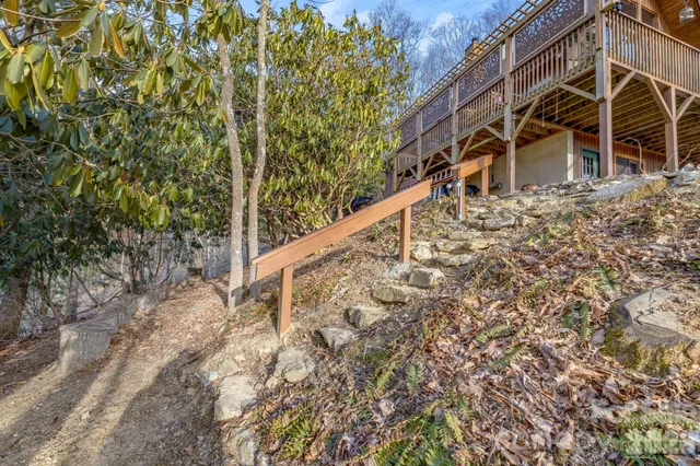 a view of a house with a yard and balcony