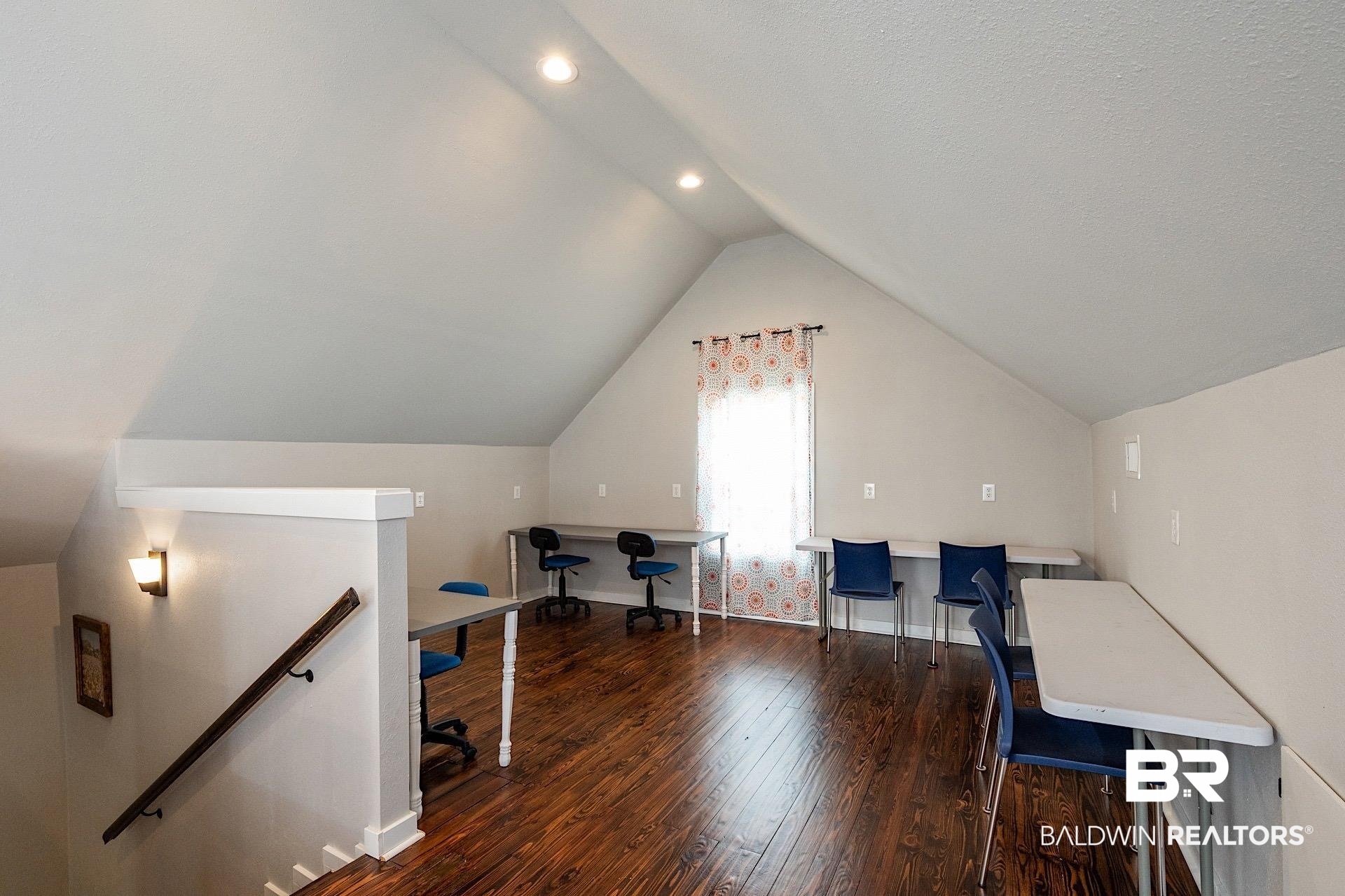 22051 Broad Street Silverhill, AL 36576 - Photo 15 of 28 Office space featuring dark hardwood / wood-style flooring and lofted ceiling