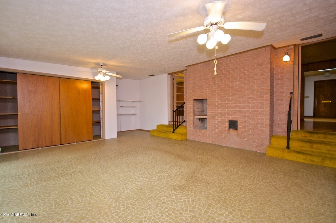 4149 Rogero Road Jacksonville, FL 32277 - Photo 21 of 27 a view of empty room with a ceiling fan