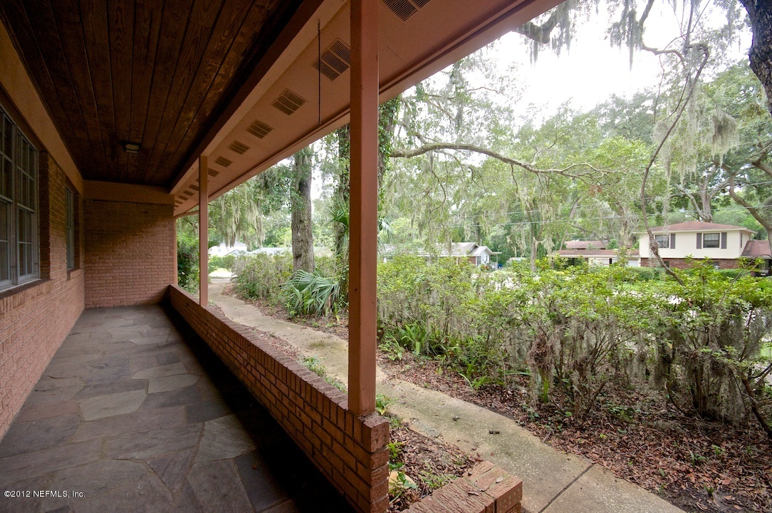 4149 Rogero Road Jacksonville, FL 32277 - Photo 22 of 27 a view of a back yard from a balcony