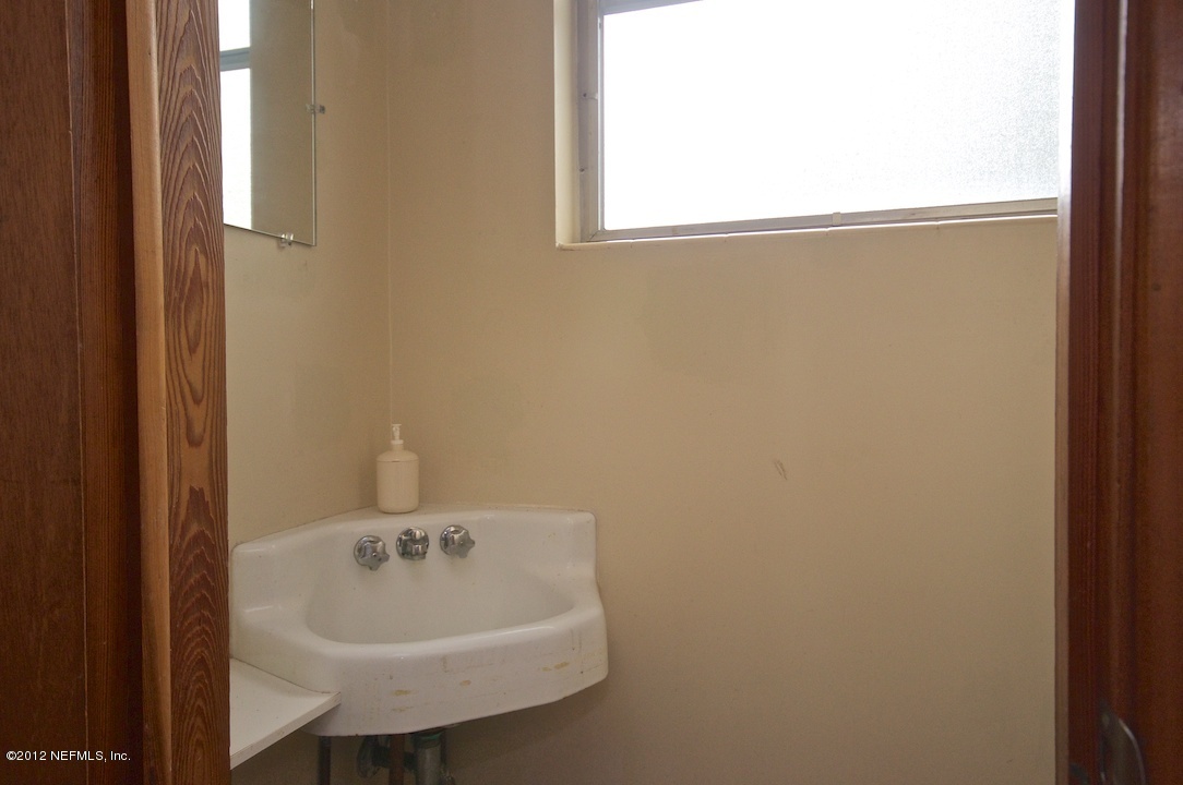 4149 Rogero Road Jacksonville, FL 32277 - Photo 27 of 27 a bathroom with a sink and a bathtub
