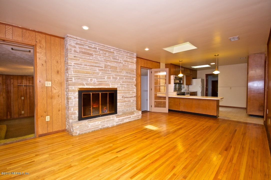 4149 Rogero Road Jacksonville, FL 32277 - Photo 9 of 27 a view of a kitchen with a sink and a fireplace