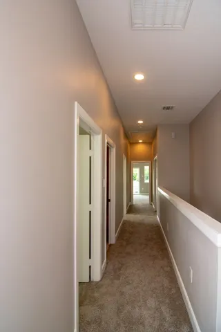 a view of hallway with stairs