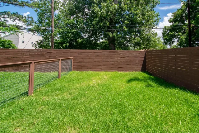 a backyard of a house with lots of green space