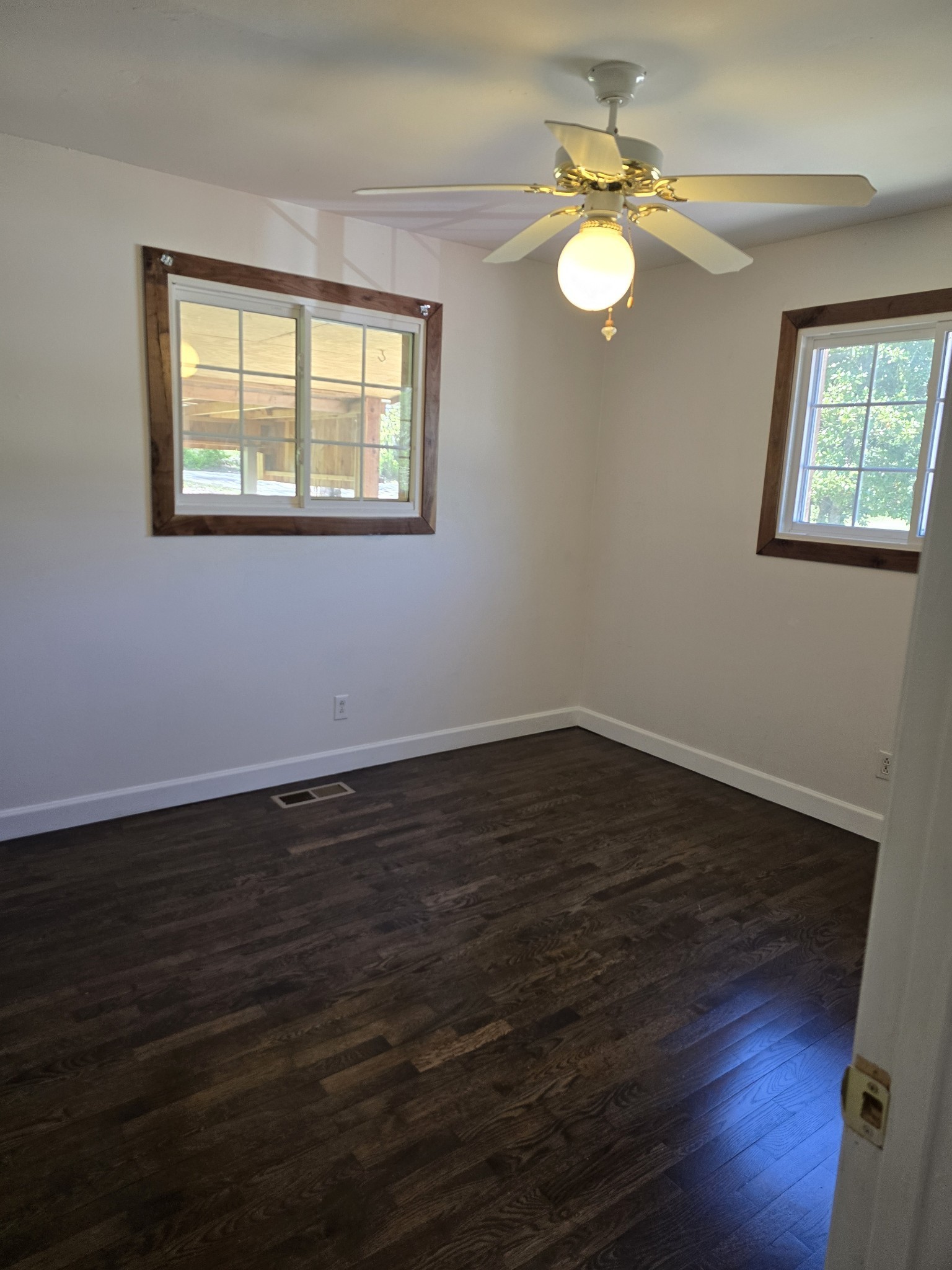 158 Swan Mill Road McMinnville, TN 37110 - Photo 7 of 10 a view of an empty room with wooden floor and a window
