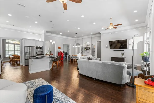 a kitchen with counter top space a sink cabinets and stainless steel appliances