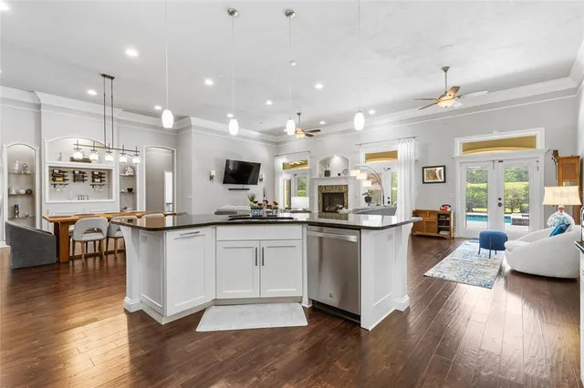 a dining room with furniture and wooden floor