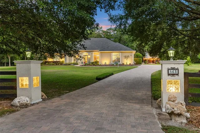 a view of a street with a building and a street sign