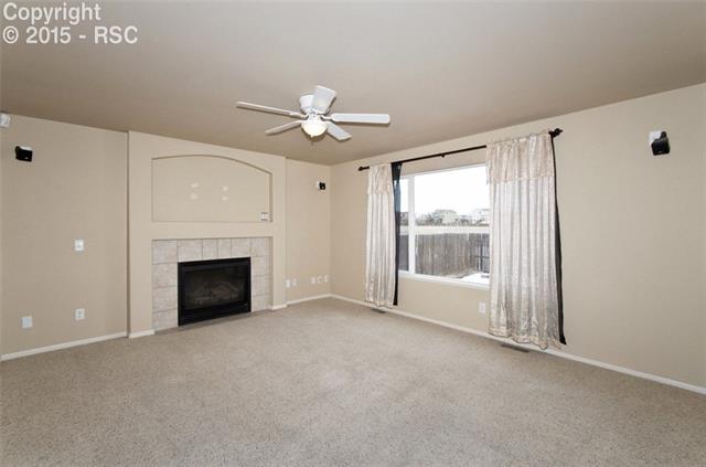7571 Old Spec Road Peyton, CO 80831 - Photo 13 of 34 Family room with Fireplace