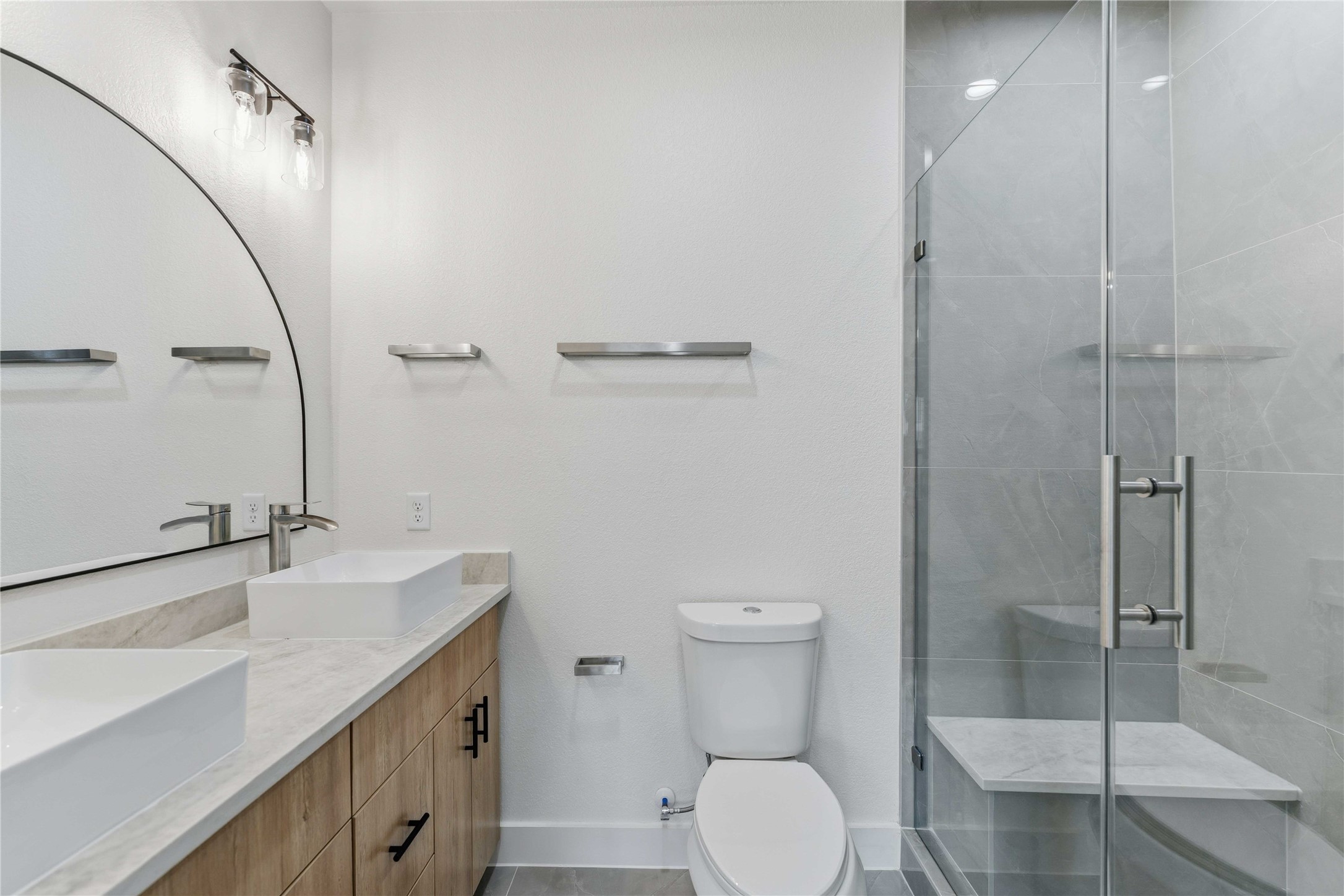 4314 Stassen Street Houston, TX 77051 - Photo 12 of 28 a bathroom with a sink a toilet and shower