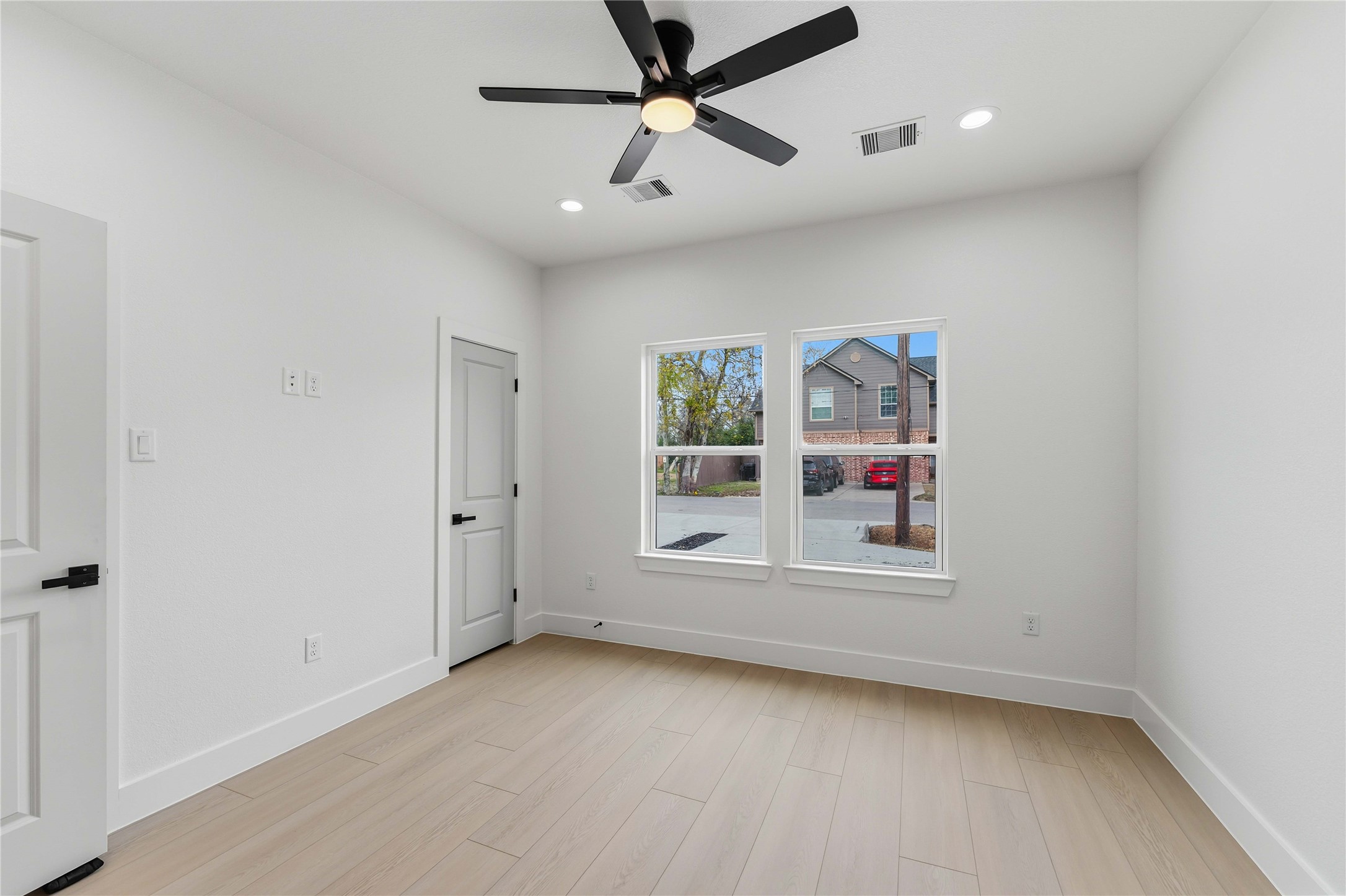 4314 Stassen Street Houston, TX 77051 - Photo 16 of 28 a view of empty room with wooden floor and fan