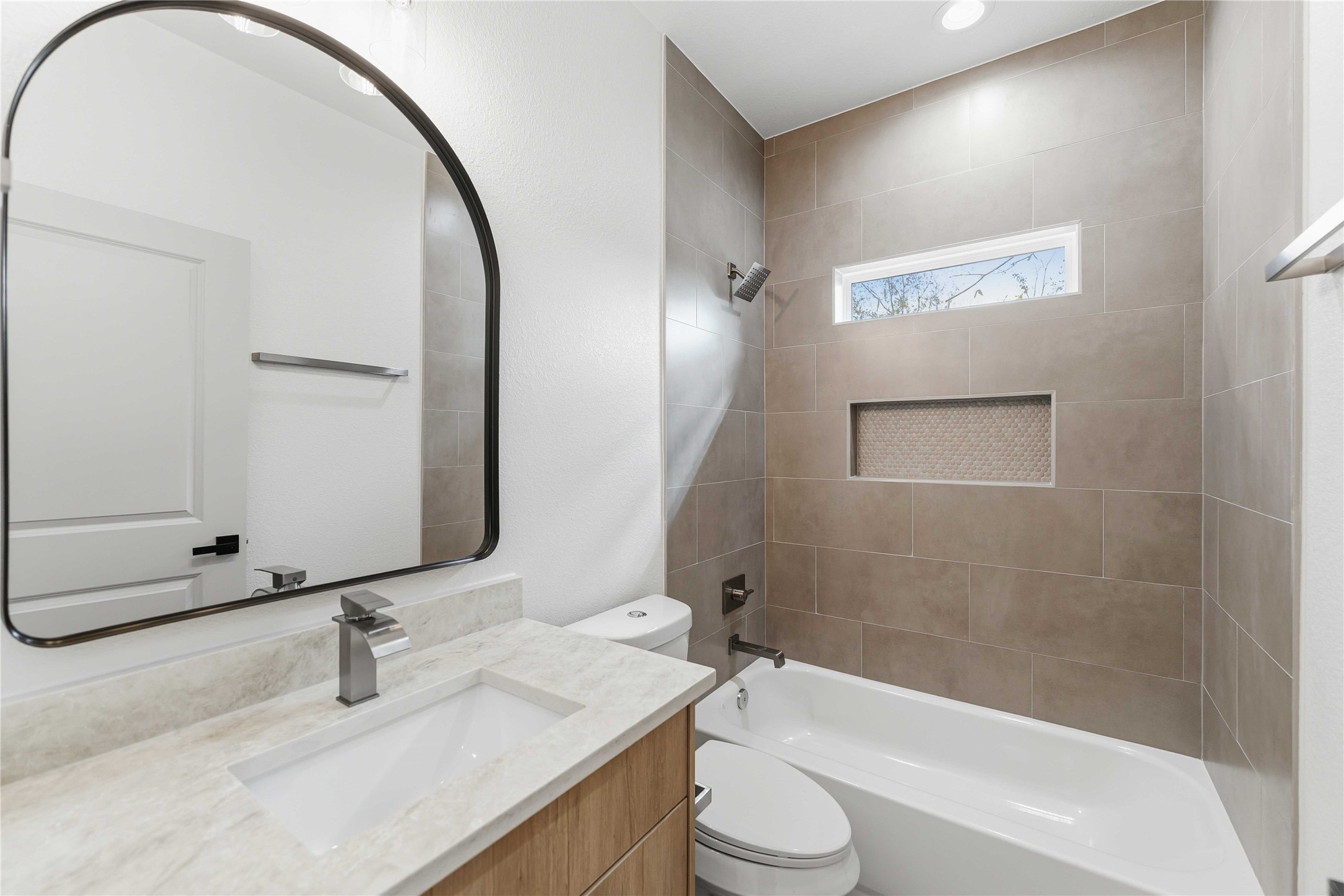 4314 Stassen Street Houston, TX 77051 - Photo 17 of 28 a bathroom with a granite countertop sink toilet and shower