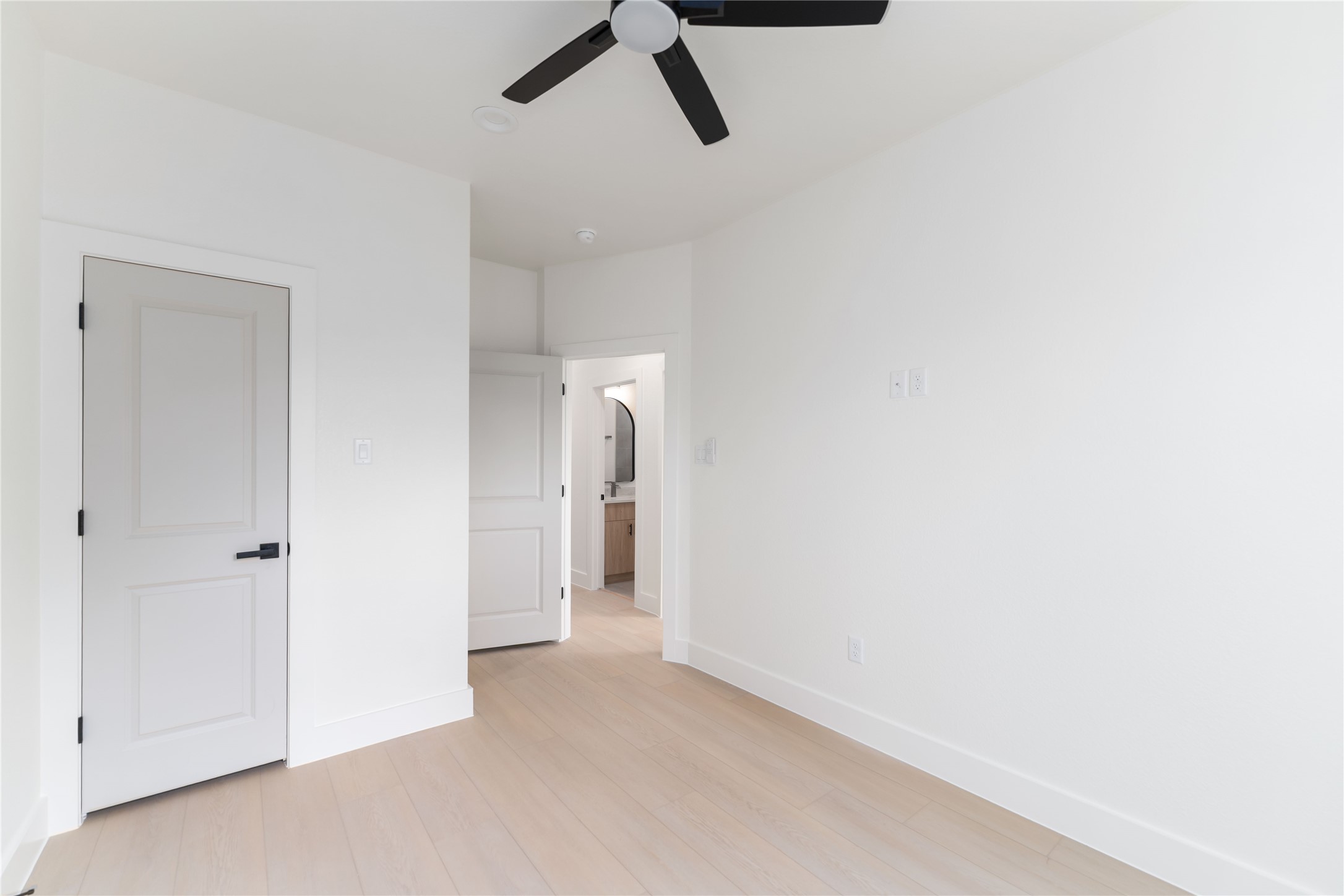 4314 Stassen Street Houston, TX 77051 - Photo 19 of 28 a view of a livingroom with a ceiling fan & entryway