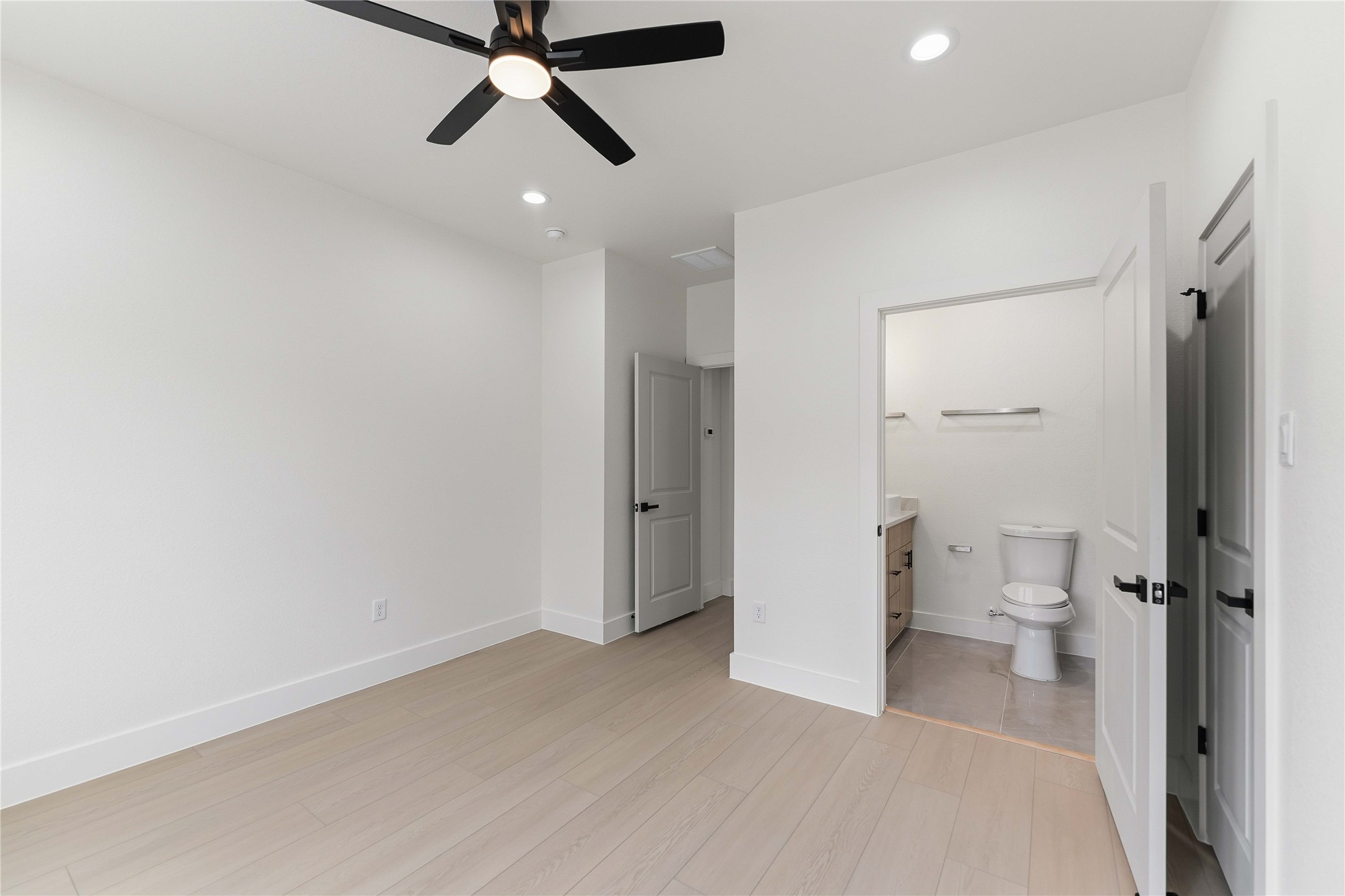 4314 Stassen Street Houston, TX 77051 - Photo 23 of 28 a view of a room with a ceiling fan and shower