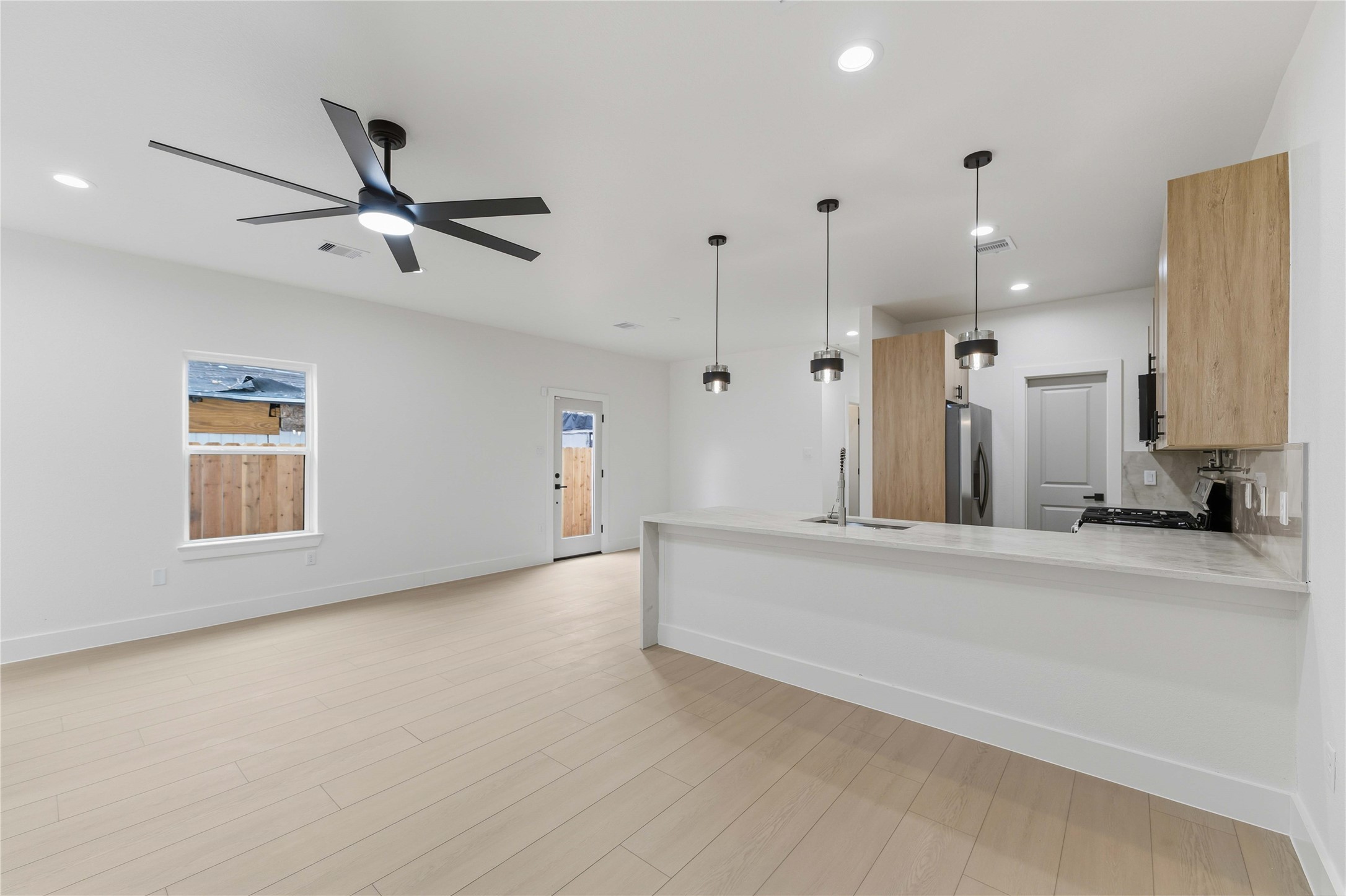 4314 Stassen Street Houston, TX 77051 - Photo 6 of 28 wooden floor in an empty room with a window