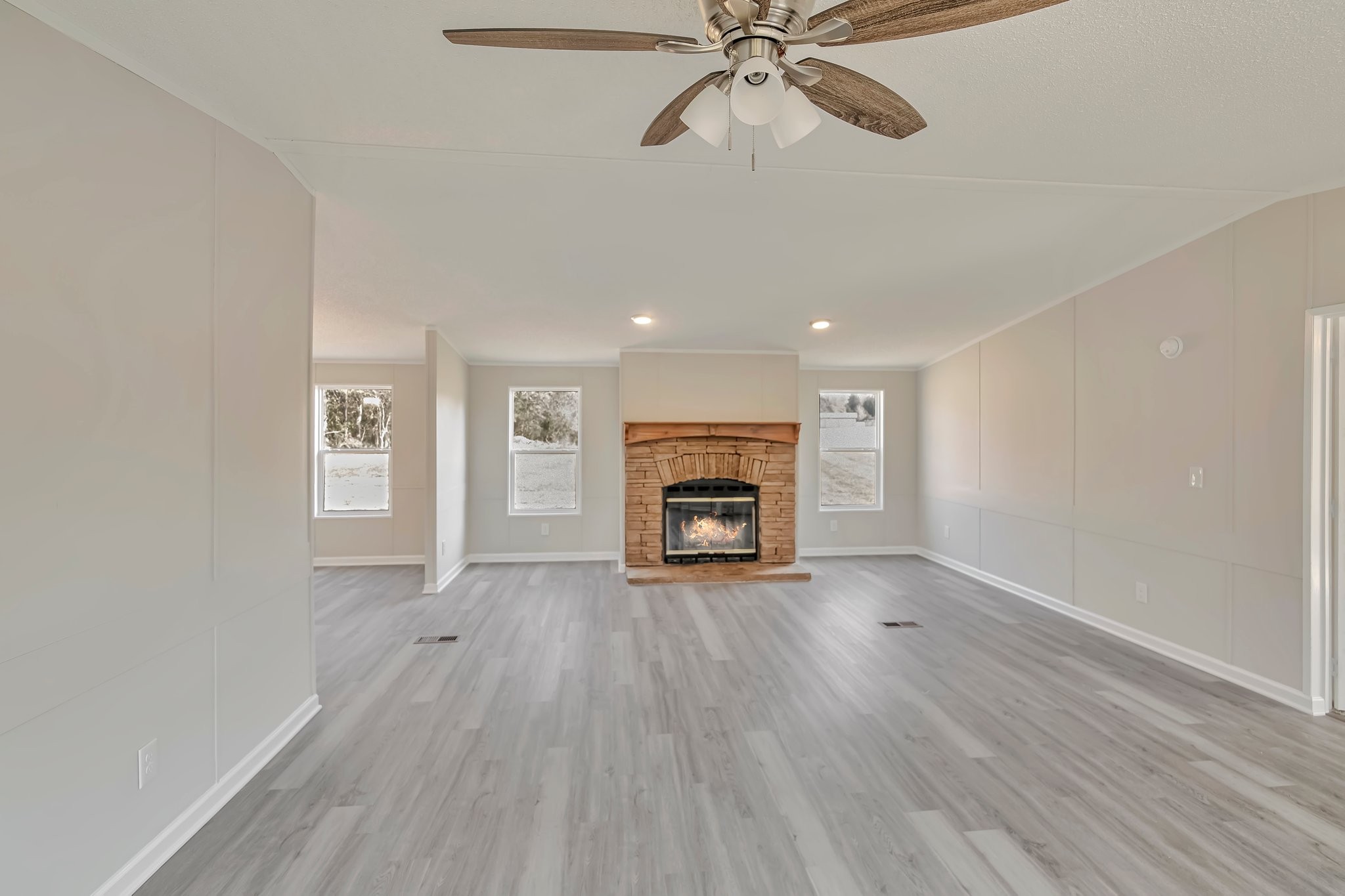 77 Centerville Road Lebanon, TN 37087 - Photo 12 of 22 wooden floor in an empty room with a fireplace
