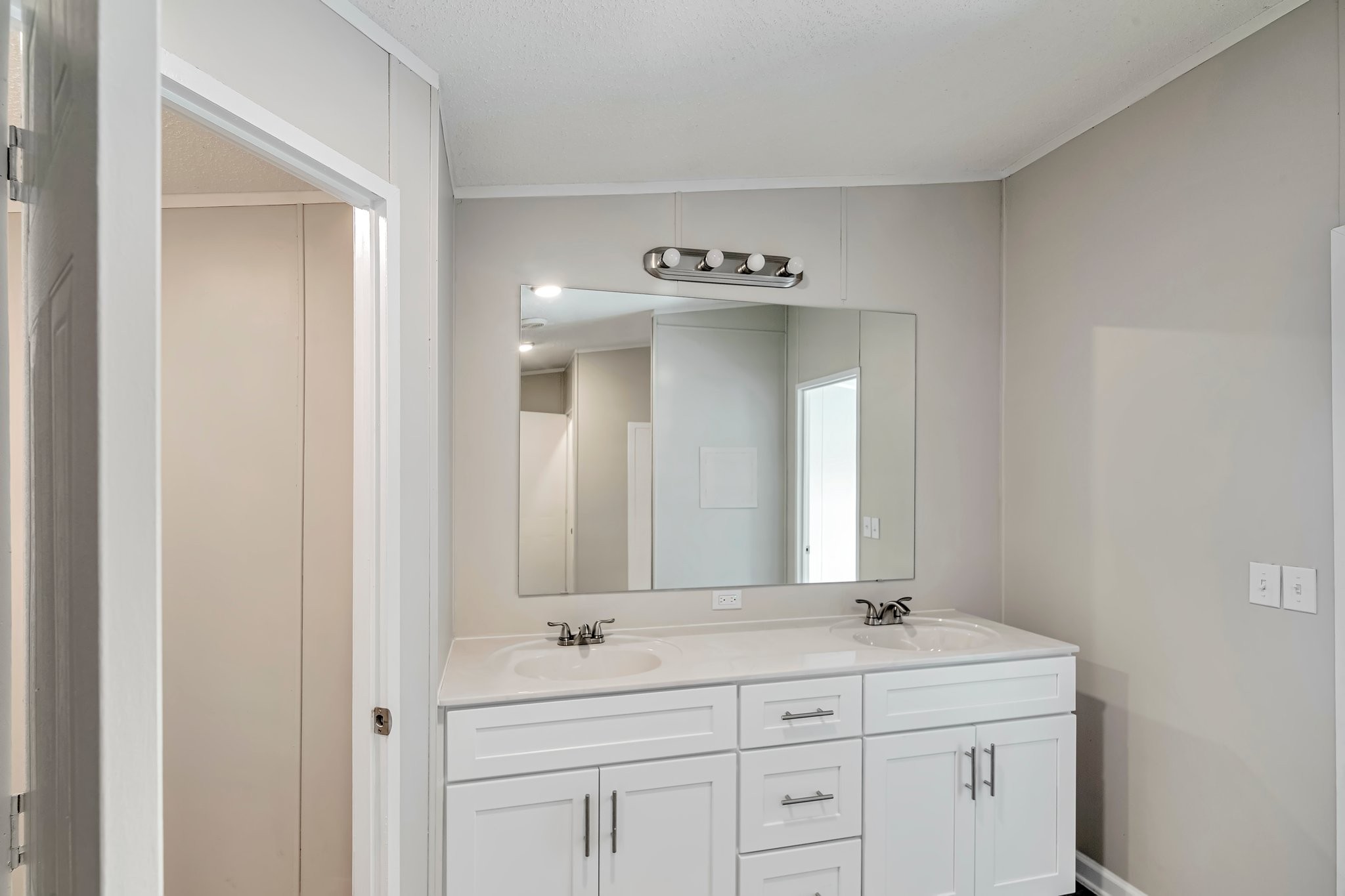 77 Centerville Road Lebanon, TN 37087 - Photo 17 of 22 a bathroom with a double vanity sink and mirror