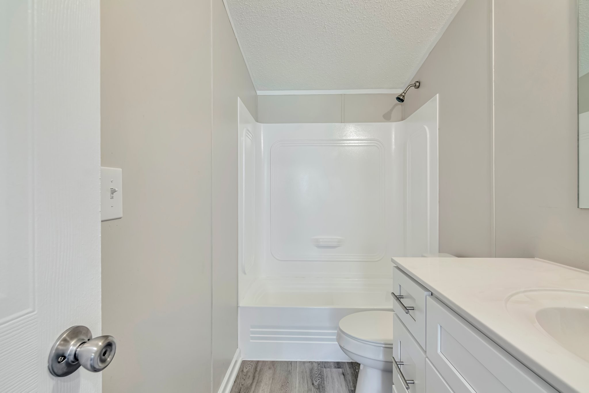 77 Centerville Road Lebanon, TN 37087 - Photo 5 of 22 a bathroom with a granite countertop toilet and a shower