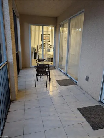 a lobby with furniture and a tub