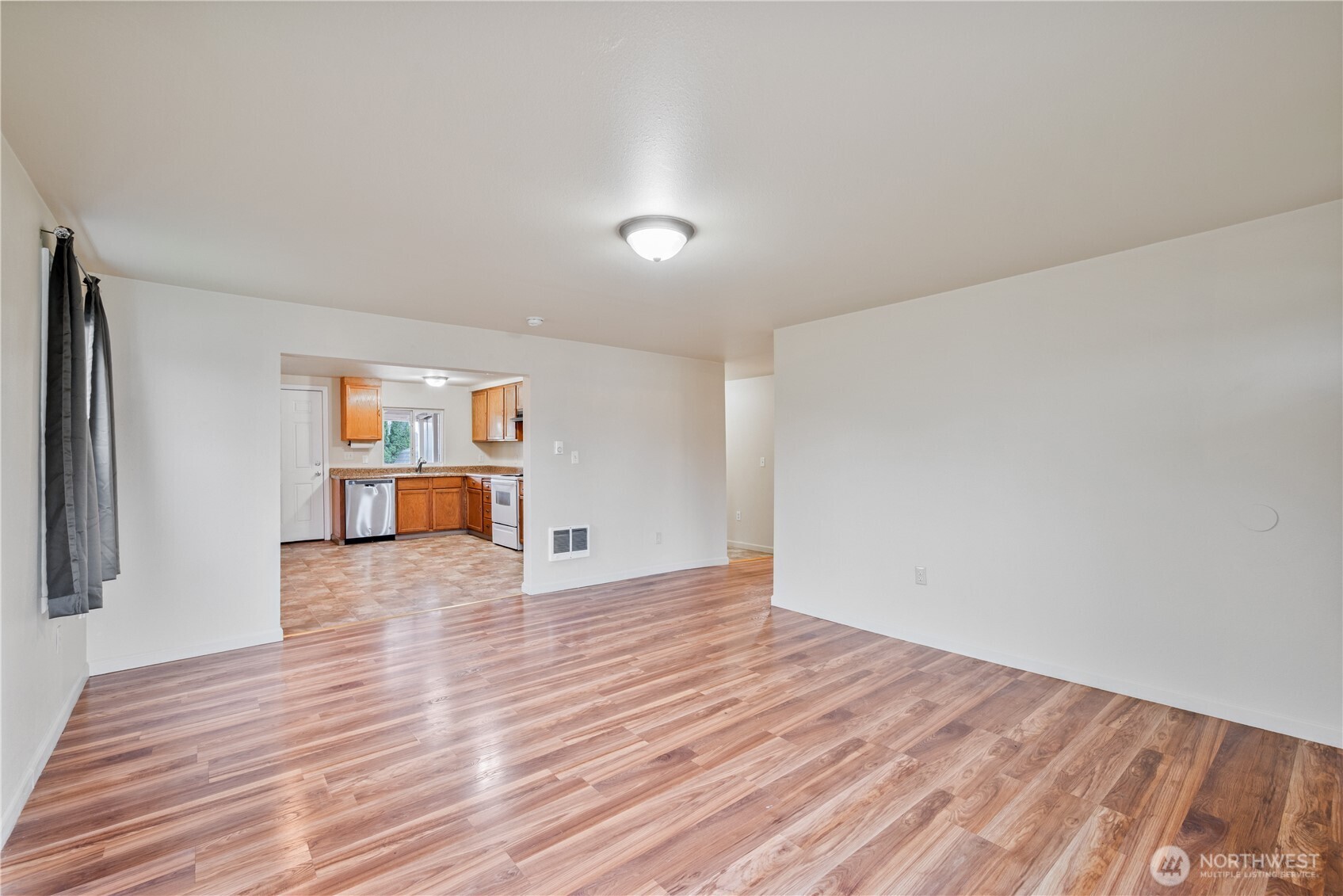 96 Dirk Lane Kelso, WA 98626 - Photo 3 of 13 a view of empty room with wooden floor