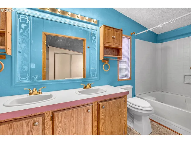 a bedroom with a bed and a table