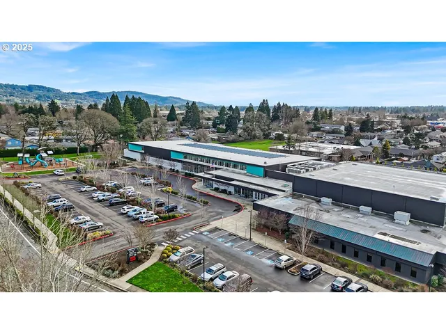 a view of a swimming pool with outdoor seating