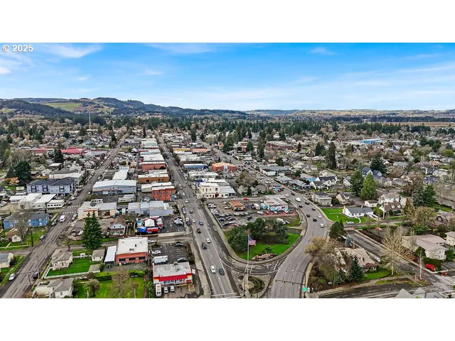 a view of a street with a building in the background