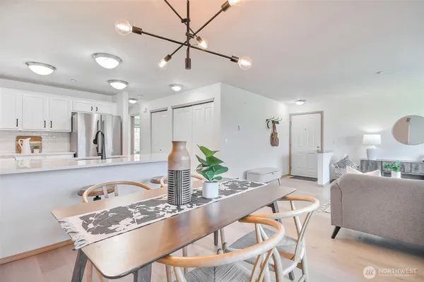 a kitchen with stainless steel appliances white cabinets and a sink