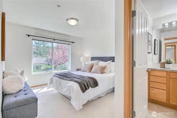 a bedroom with a bed and a cabinets