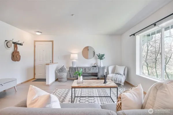 a living room with furniture and a table
