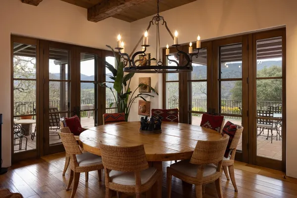 a view of a dining room with furniture window and wooden floor
