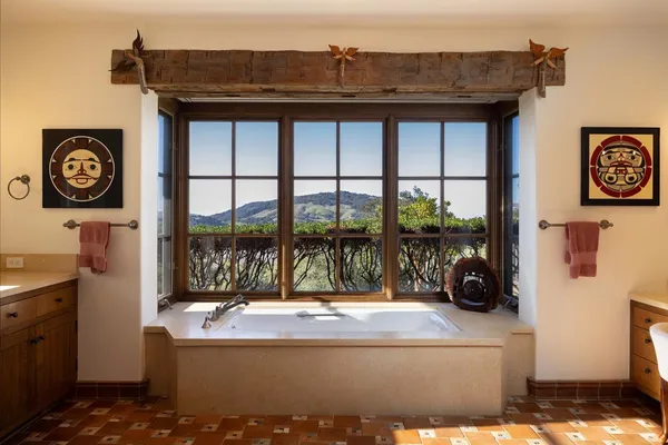 a view of a kitchen area with furniture and floor to ceiling window