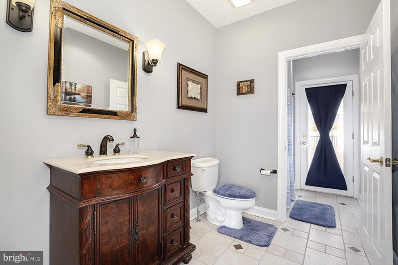 4320 Valley View Road Middletown, MD 21769 - Photo 14 of 30 a bathroom with a toilet sink and mirror
